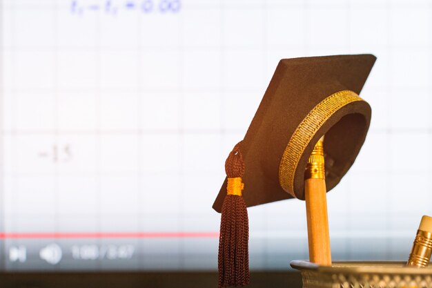 premium-photo-graduation-hat-on-pencils-with-formula-arithmetic