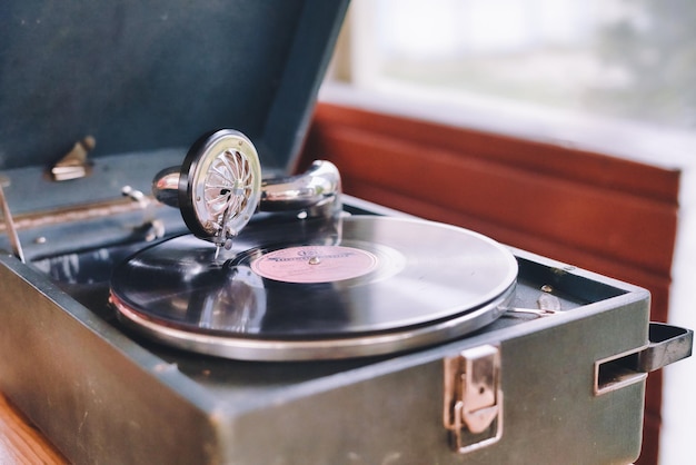 Premium Photo | The gramophone record is played on the old potiphon