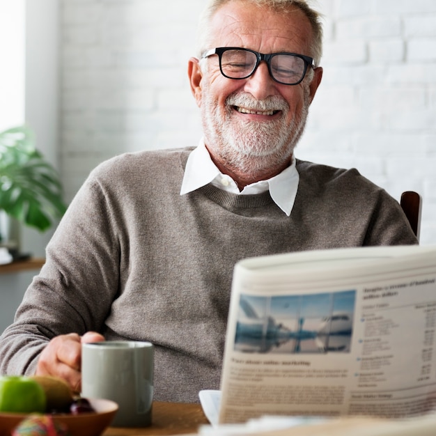 Premium Photo | Grandfather newspaper coffee retirement man concept