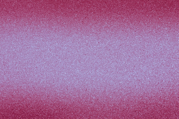 Granite background of pink color with small dots. darkening from the top and bottom. Premium Photo