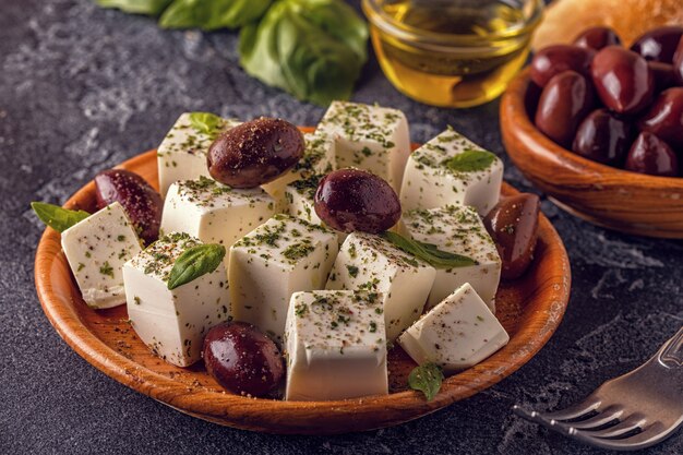 Premium Photo | Greek cheese feta with oregano and olives