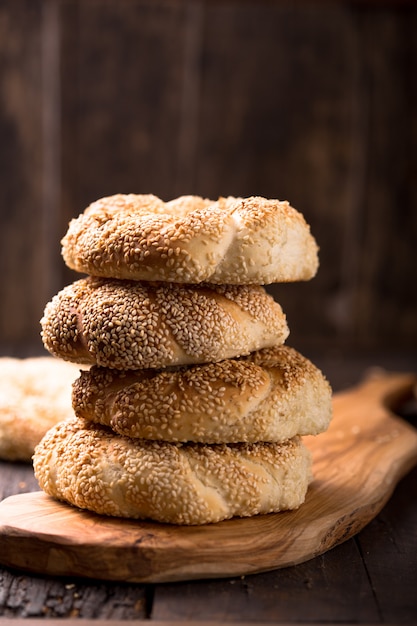 Premium Photo | Greek koulouri or turkish bagels called simit in stack ...