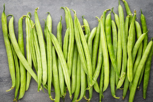 Premium Photo | Green beans on a gray background.