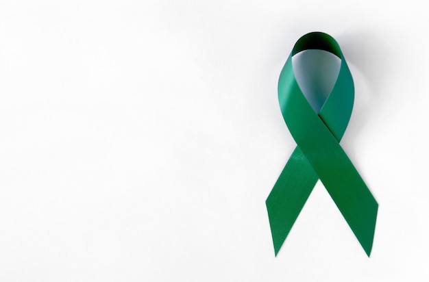 Premium Photo | Green cancer awareness symbolic ribbon