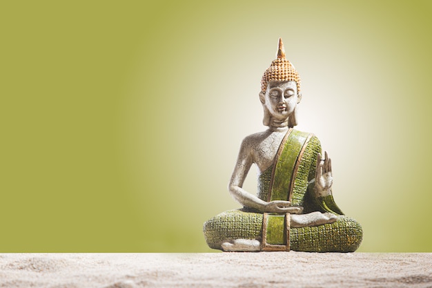 Premium Photo Green And Golden Buddha Statue On Sand Meditation Spirituality And Zen Concept