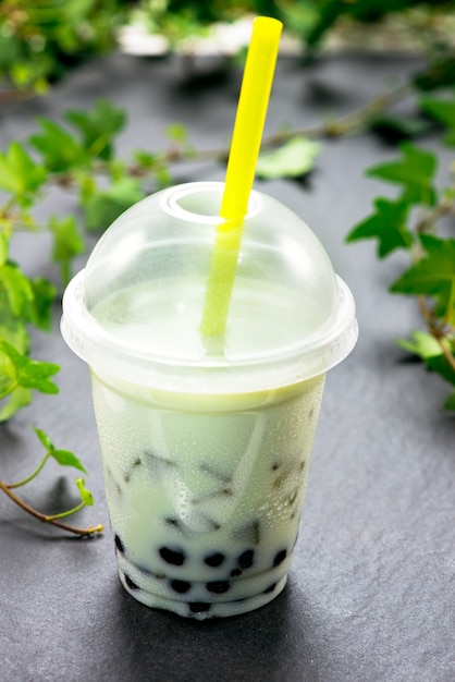 Premium Photo | Green matcha bubble tea and black tapioca pearls