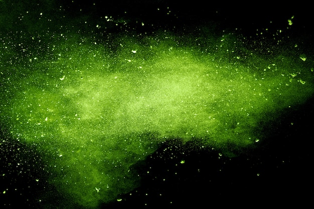 Premium Photo Green Powder Explosion On Black Backgroundgreen Dust