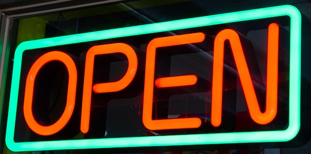 Premium Photo | Green and red neon open sign at night store bar ...