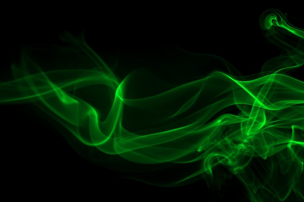 Premium Photo | Green smoke abstract on black background and darkness ...