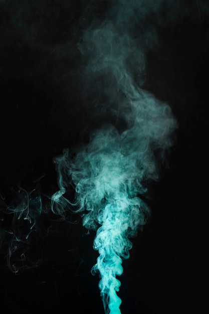 Green smoke movement on dark background