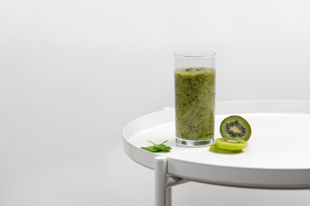 Green Smoothie In A Glass With Slices, Round Table Slices