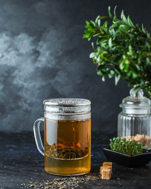 Premium Photo | Green tea large leaf freshly brewed drink