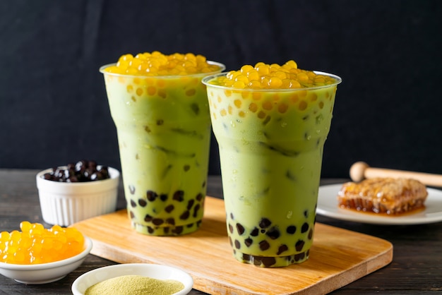 Premium Photo | Green tea latte with bubble and honey bubbles