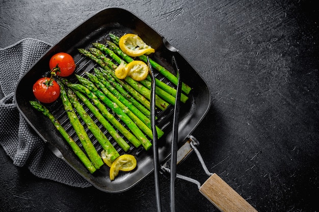 Grilled asparagus on grill pan Photo | Free Download