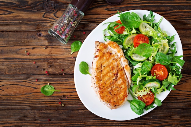 Free Photo Grilled Chicken Breast And Fresh Vegetable Salad Tomatoes Cucumbers And Lettuce Leaves Chicken Salad Healthy Food Flat Lay Top View