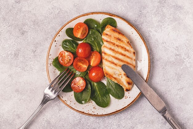 Premium Photo Grilled Chicken Breast Served With Vegetable Salad