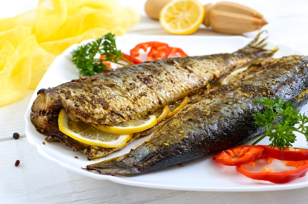 Premium Photo | Grilled herring with lemon and spices