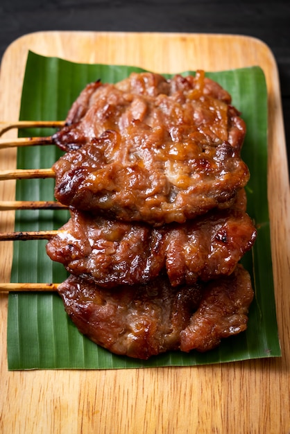 Premium Photo Grilled Skewered Milk Pork With White Sticky Rice