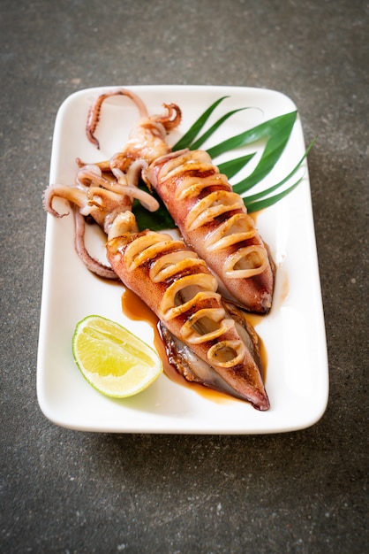 Premium Photo | Grilled squid with teriyaki sauce