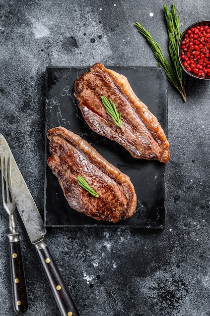 Premium Photo | Grilled top sirloin cap or picanha steak on a stone ...