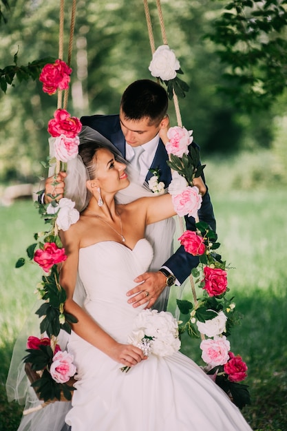 Premium Photo | Groom and bride on swing