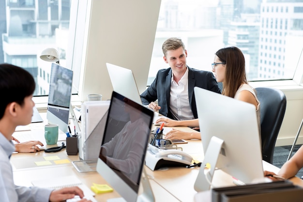 Group of business people coworkers working in office space ...