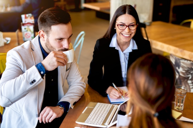 Premium Photo | Group of business people having casual conversation at ...