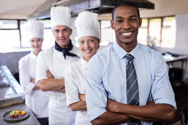 Premium Photo | Group Of Chefs And Manager Standing With Arms Crossed ...