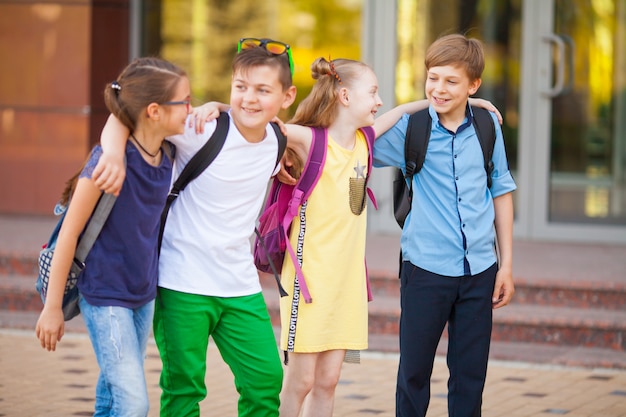 Premium Photo | A group of children goes to college.