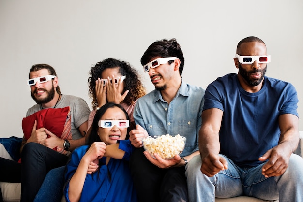 Premium Photo | Group of diverse friends watching 3d movie together