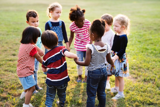 Premium Photo | Group of diverse kids playing at the field together