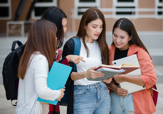 Premium Photo | Group of four attractive asian college students ...