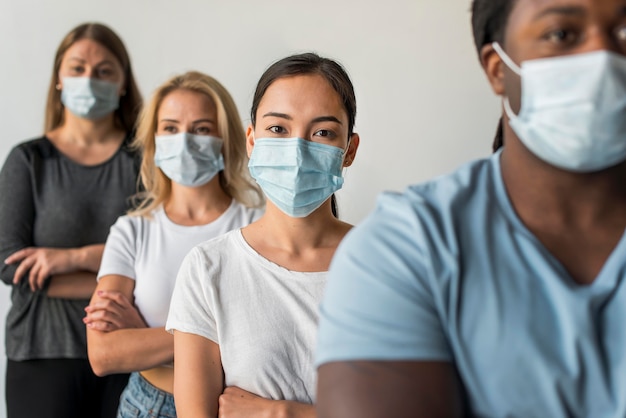 Group of friends wearing face masks Free Photo