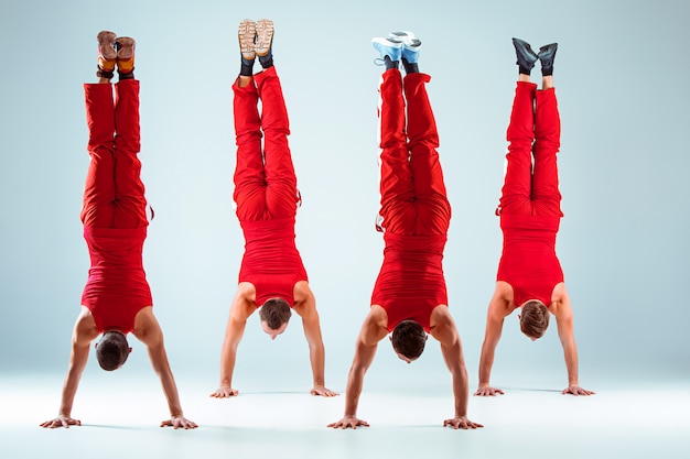 Free Photo | Group of gymnastic acrobatic caucasian men on balance pose