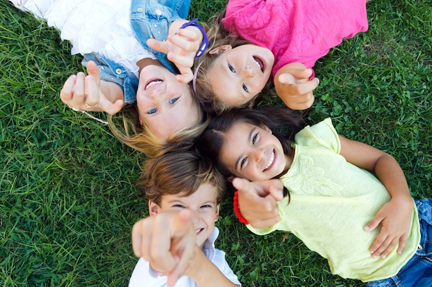 Group of childrens having fun in the park. Free Photo