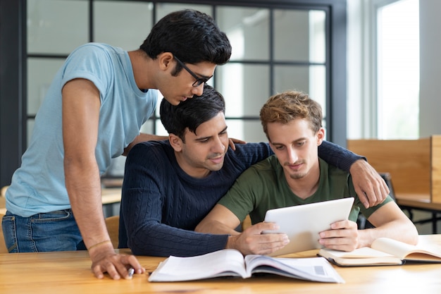 Group Of Friends Studying Together Helping Each Other Photo Free