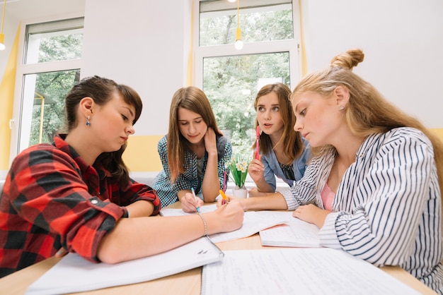 Group of girls studying in library Photo | Free Download