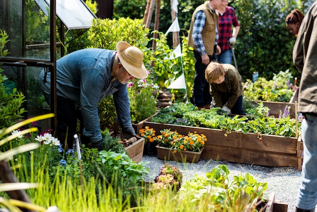 Premium Photo | Group of people gardening backyard together