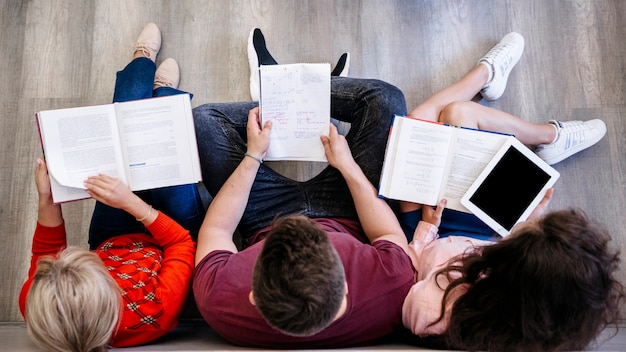 Group of people studying on floor Free Photo