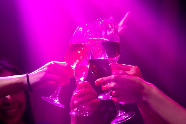 Premium Photo Group Of People Toast Drinks At Party In Dancing Club 