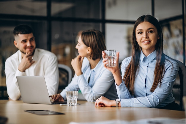 Group of people working out business plan in an office Free Photo
