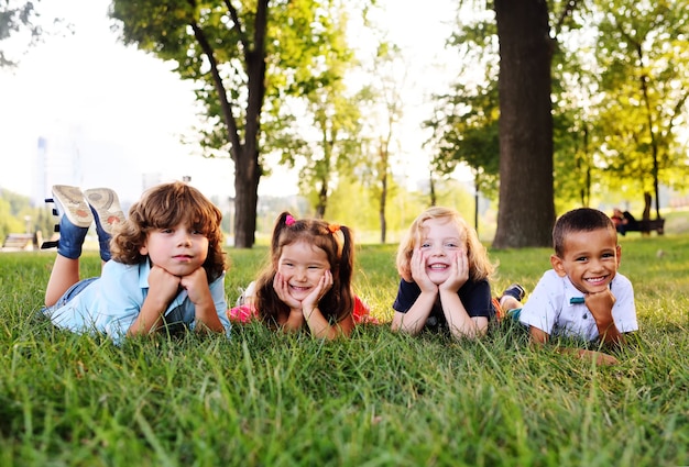 Premium Photo | Group of preschool children playing in the park on the ...