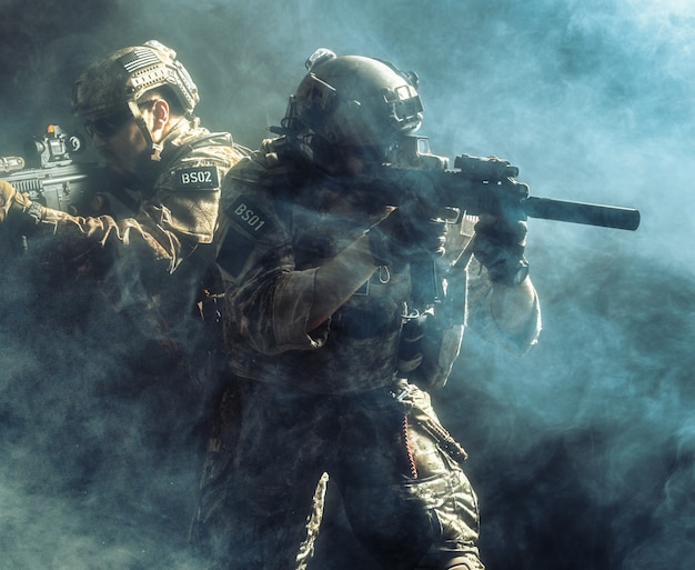 Premium Photo | Group of security forces in combat uniforms with rifles