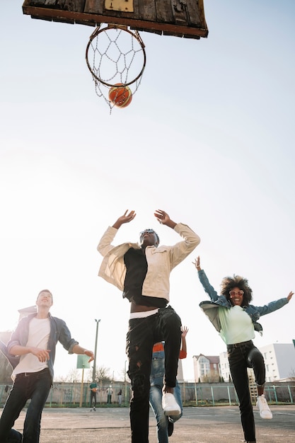 Free Photo | Group of teenagers playing basketball together