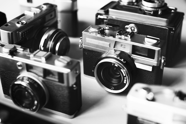 Premium Photo | Group of vintage film cameras grayscale