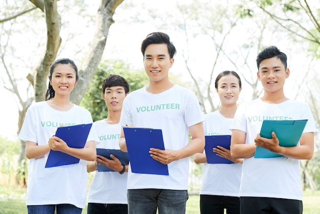 Premium Photo | Group of young asian volunteers standing outdoors