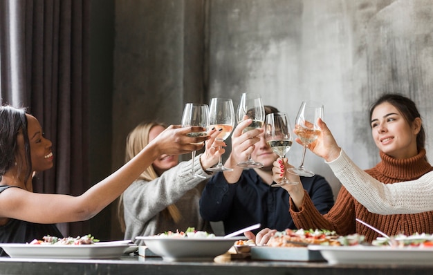 Premium Photo Group Of Young People Toasting Wine Glasses 8278