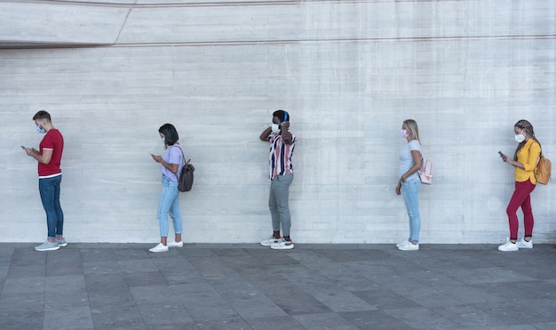 Premium Photo | Group of young people waiting for going inside a shop