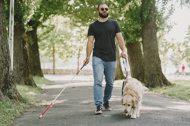 Free Photo | Guide dog helping blind man in the city. handsome blind ...