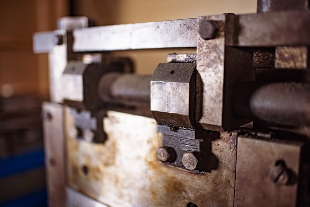 Premium Photo | Guillotine machine close-up rusty metal massive parts